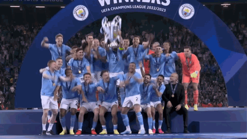 Soccer Players Posing With Champions League Trophy