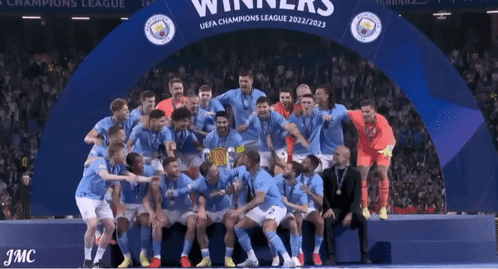 Soccer Players Posing With Champions League Trophy