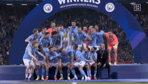 Soccer Players Posing With Champions League Trophy