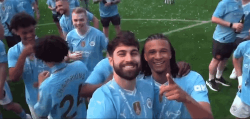 Soccer Players Posing with Number 2