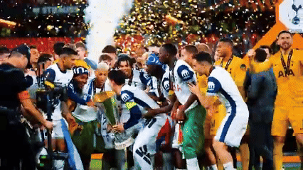 Soccer Players Posing With Trophy