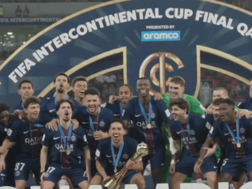 Soccer Players Posing With Trophy