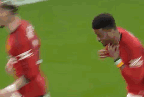 Soccer Players Running On Field With Crowd GIF