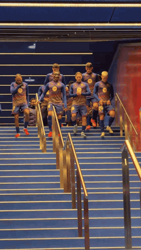 Soccer Players Running Up Stairs
