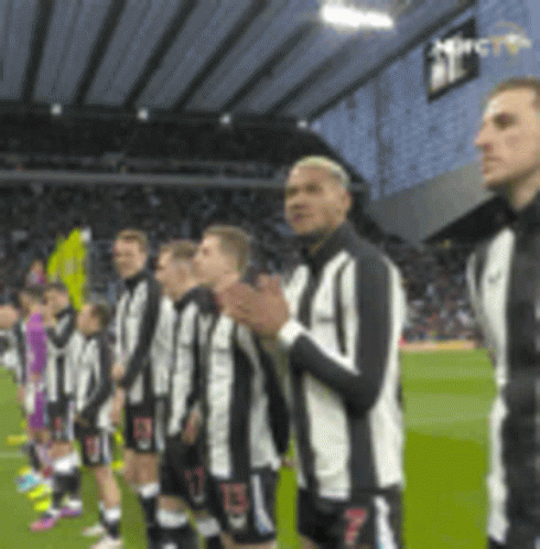 Soccer Players Standing on Field