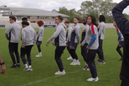 Soccer Players Standing on Field