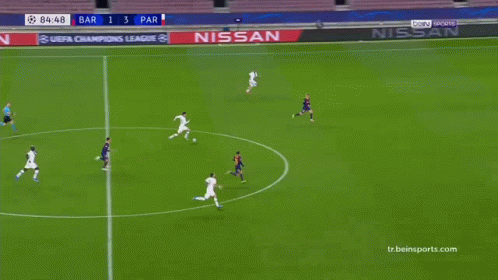 Soccer Players Standing on Field With TikTok Banner