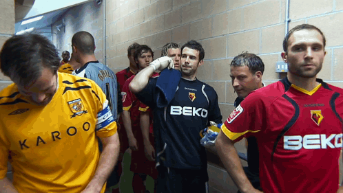 Soccer Players Wearing Beko Jerseys in Locker Room