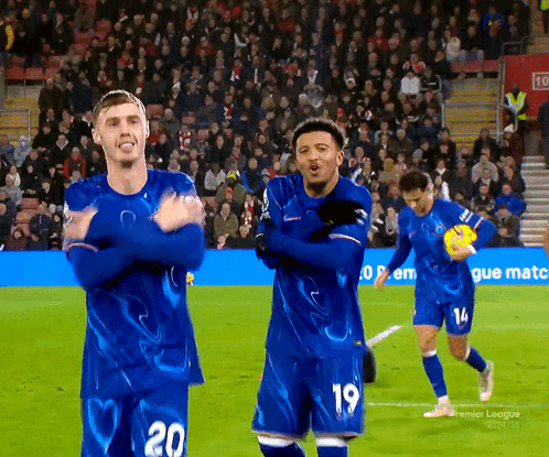 Soccer Players Wearing Blue Jerseys With The Number 20 On The Front GIF