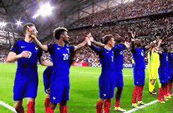 Soccer Players With Hands in the Air