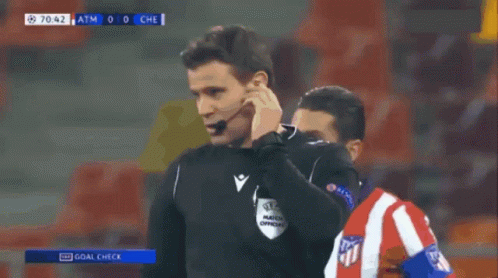 Soccer Referee Pointing at Player