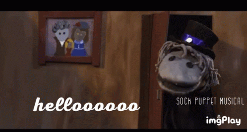Sock Puppet Saying Hellooooo to Man and Woman