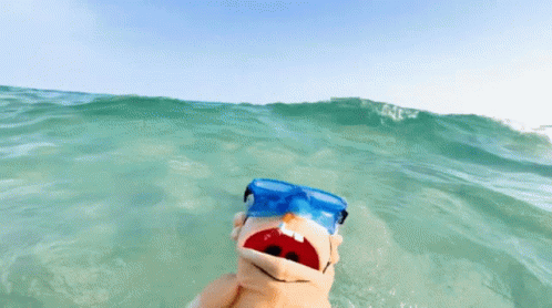 Sock Puppet Swimming in Ocean with Goggles