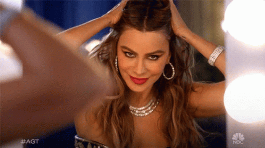 Sofia Vergara Winking In The Mirror GIF