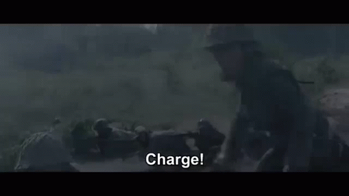 Soldier in Helmet Holding Gun Says Charge