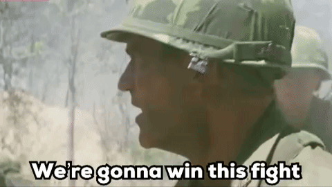 Soldier in Helmet Talking to Another Soldier