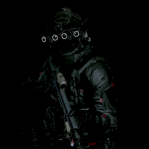 Soldier in Helmet With Circles Holding Gun