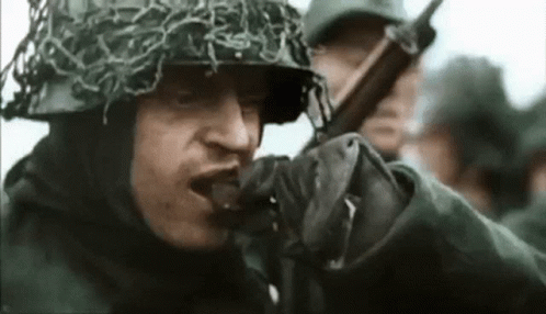 Soldier Wearing Helmet and Gloves Holding Gun