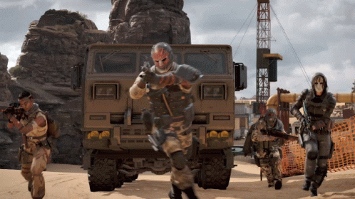 Soldiers in Front of Large Military Vehicle