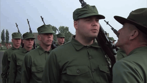 Soldiers in Green Uniforms With Guns