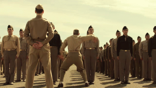 Soldiers Kicking Another Soldier GIF