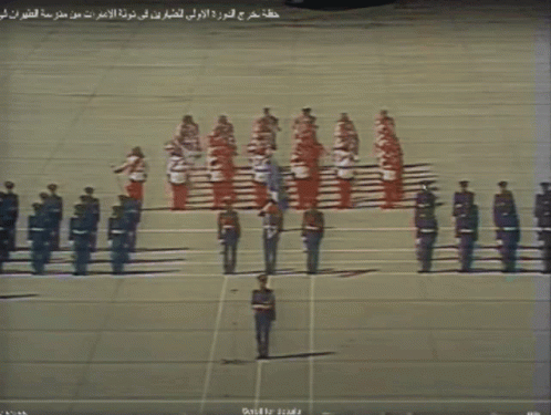 Soldiers Lined Up With Arabic Writing GIF