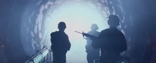 Soldiers Looking At Light In Tunnel GIF