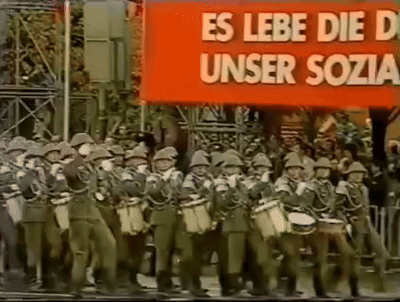 Soldiers Marching in Front of Banner Es Lebe Die D Unser Sozia