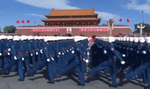 Soldiers Marching In Front Of Building With Chinese Writing GIF