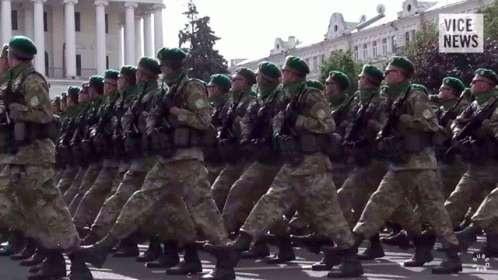 Soldiers Marching in Front of Vice News Building