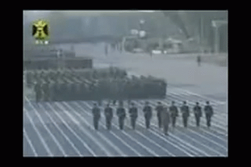 Soldiers Marching in Line on Parade Track