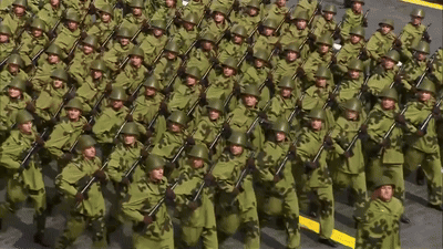 Soldiers Marching in Line with Guns
