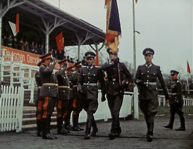 Soldiers Marching Past Deutschen Demokrat Sign