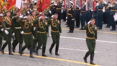 Soldiers Marching With Badge Saying A