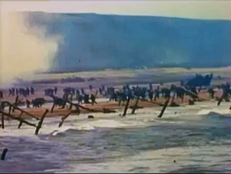 Soldiers on Beach with Barbed Wire