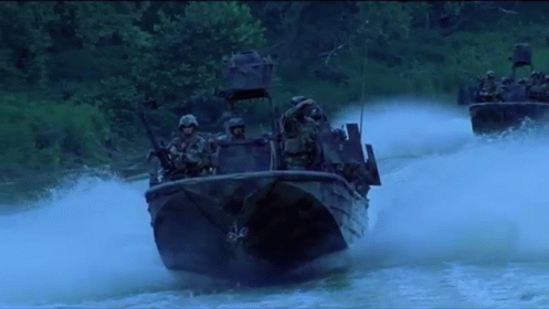 Soldiers Riding Boats Down River GIF