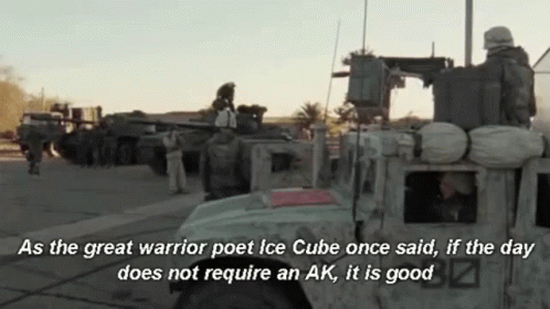 Soldiers Standing by Military Vehicle With Quote