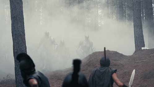 Soldiers Standing In Woods With Smoke GIF