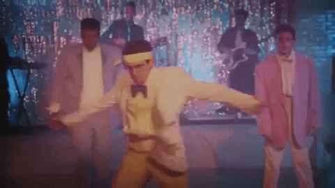 Someone Dancing And Spinning Wearing Yellow Tux GIF