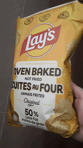 Someone Holding Bag Of Oven Baked Chips GIF