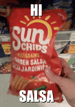 Someone Is Holding A Bag Of Sun Chips In Salsa GIF