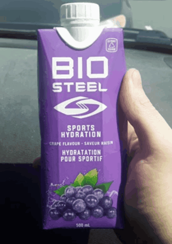 Someone Is Holding A Purple Box Of Bio Steel Sports Hydration GIF