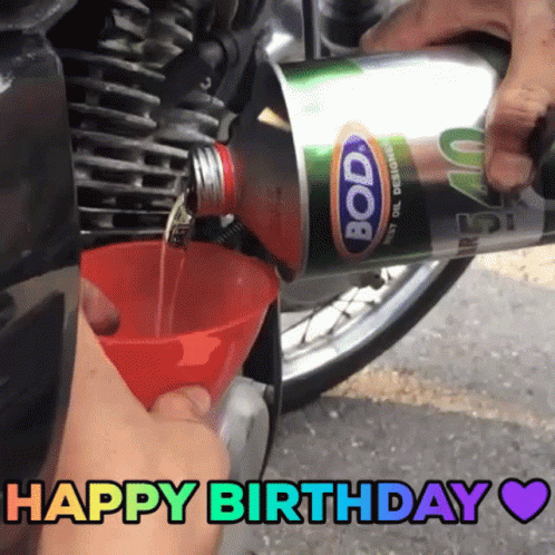 Someone Is Pouring Bode Oil Into A Motorcycle GIF