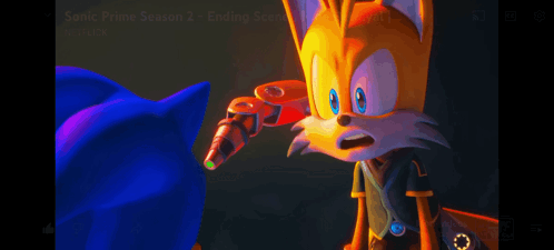 Sonic The Hedgehog And Tails The Fox Are Standing Next To Each Other In A Dark Room GIF