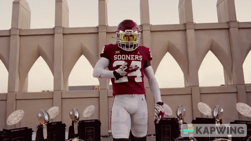 Sooners Football Player With Trophies GIF