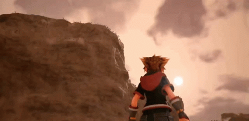 Sora From Kingdom Hearts 3 Is Standing On Top Of A Mountain Looking At The Sun . GIF