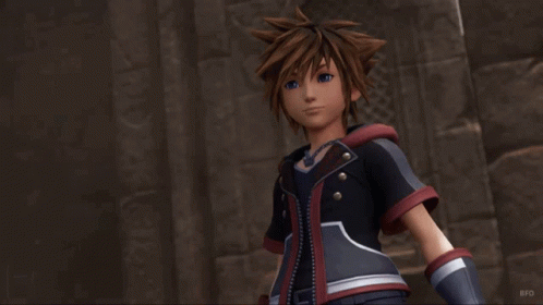 Sora From The Video Game Kingdom Hearts 3 Stands In Front Of A Stone Wall GIF