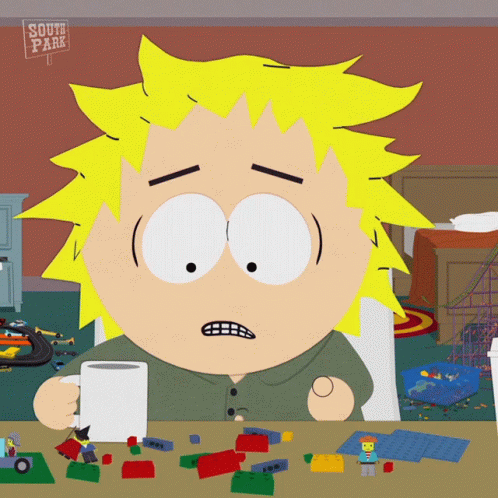 South Park Character Sitting at Table With Toys