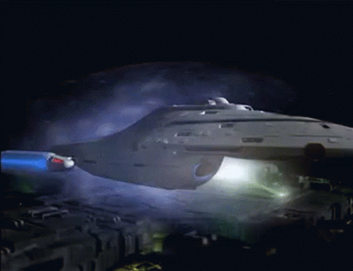 Space Ship Flying In Dark With Smoke GIF