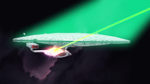 Space Ship Flying Through Space With Green Light